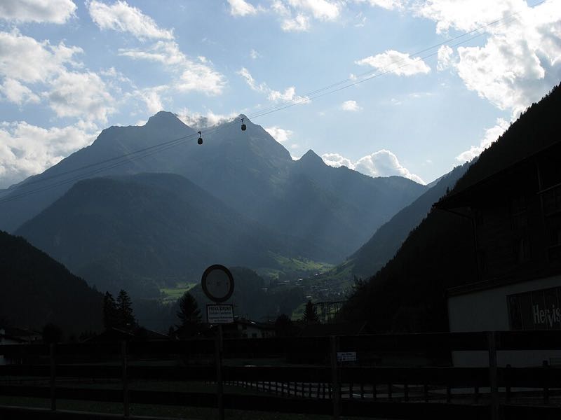 Gondola cabins crossing the valley toward the Penken mountain above Mayrhofen