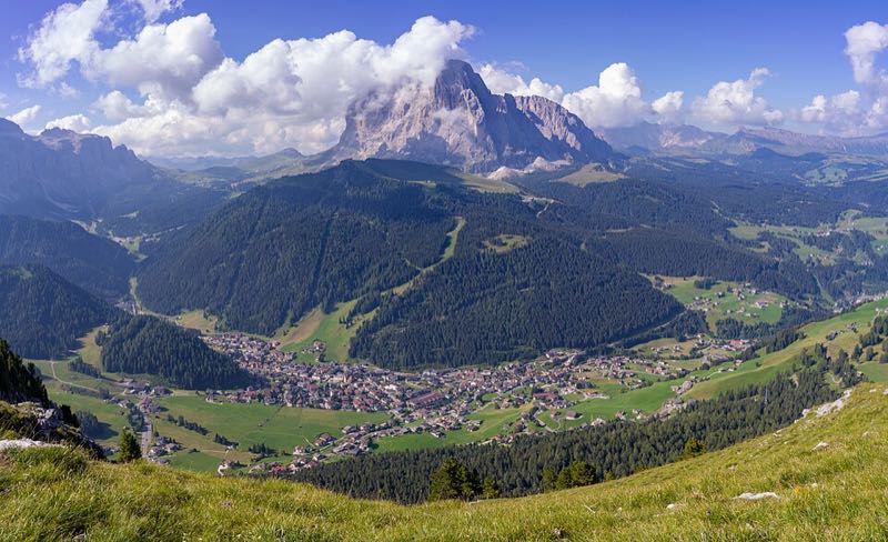 Selva di Val Gardena in its valley beneath the Sassolungo