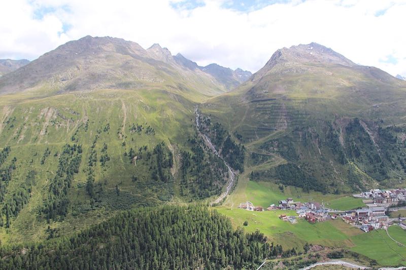 Aerial view of Obergurgl village nestled in the high Gurgler Tal valley beneath towering alpine peaks