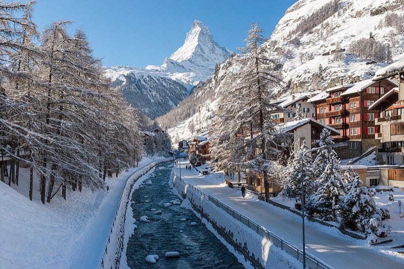 The Matterhorn above snow-covered Zermatt with the Mattervispa running through the village